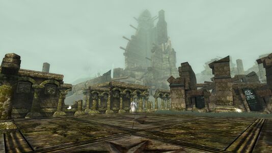 Ruined plaza with a crumbled tower in the background