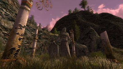 Below the bridge, an Elven statue stands vigil on the banks of the Lhûn.
