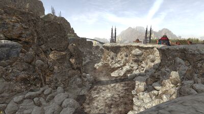 In short order, three wood bridges span the dry river bed.