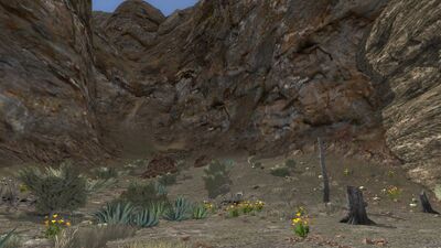 The cliff that once contained a waterfall lies silent and dry.