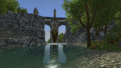 The bridge to Arnach straddles the river over another statued-guarded waterfall.