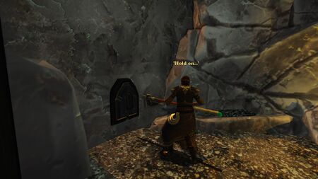 Girhâzi using her Axe to open the hidden doorway to Dubarâkh.