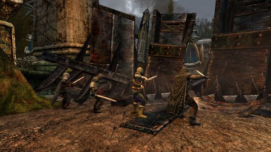 Members of the Grey Company demolishing a barricade