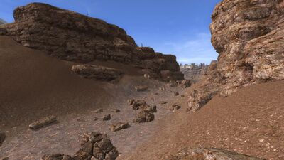Rocks which used to lay submerged now lie scattered on the dry riverbed.