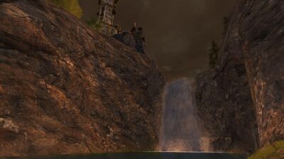 Crashing down a waterfall, the Gaelos moves through the crevasse south of Bâr Húrin.