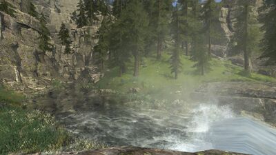 After a short stretch of calm waters, the river goes into another waterfall past a wooded glen.