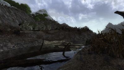 The river then starts its course through Nan Curunír, its first ford leading between Isengard and Quickbeam's Grove.