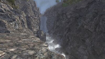 The Barûg drops in from higher up in a waterfall leading to rushing rapids.